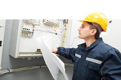 Man working in electrical control box